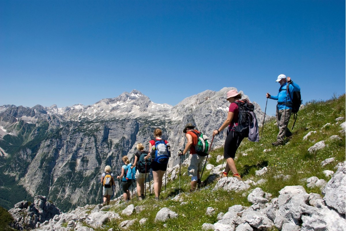 11_group of people hiking in slovenian Alps (c) Moma7_Canva (Custom).jpg
